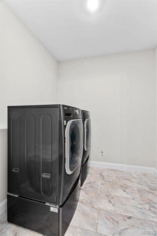 1 Canebrake Ct, Wentzville, MO 63385 - washroom with washing machine and clothes dryer, baseboards, and light marble finish floors