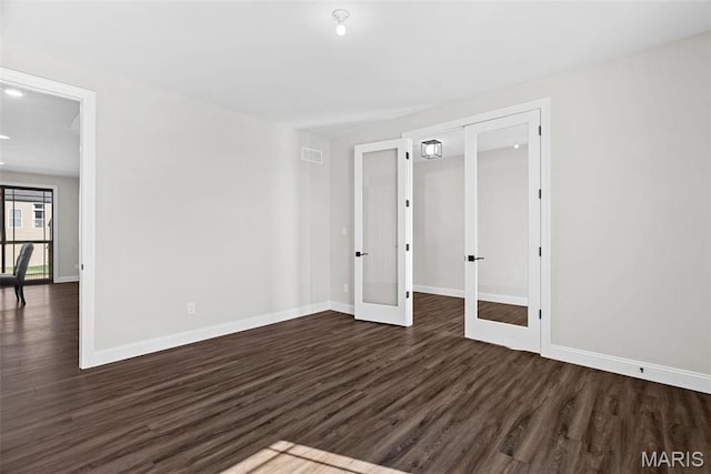 1 Canebrake Ct, Wentzville, MO 63385 - spare room with french doors, dark wood-type flooring, baseboards, and recessed lighting