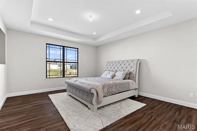 1 Canebrake Ct, Wentzville, MO 63385 - bedroom featuring a raised ceiling, dark wood-type flooring, baseboards, and recessed lighting