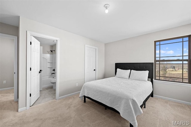 1 Canebrake Ct, Wentzville, MO 63385 - bedroom featuring light carpet, baseboards, and ensuite bath