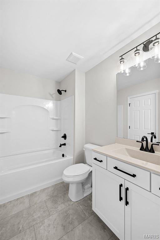 1 Canebrake Ct, Wentzville, MO 63385 - bathroom featuring vanity, toilet, and bathtub / shower combination