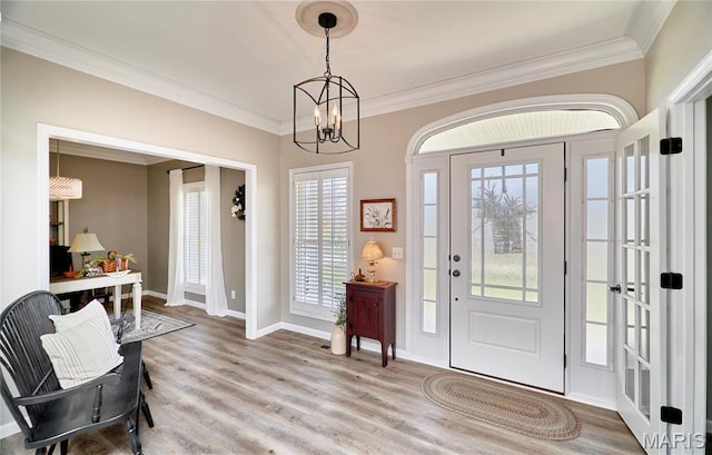 269 Bennington Dr, Troy, MO 63379 - foyer entrance featuring crown molding, plenty of natural light, wood finished floors, and a chandelier