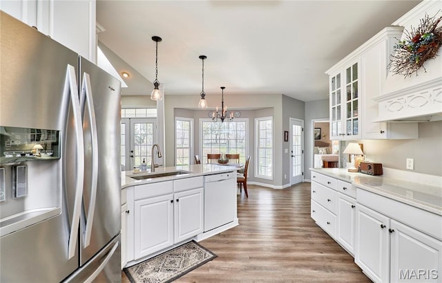 269 Bennington Dr, Troy, MO 63379 - kitchen with stainless steel refrigerator with ice dispenser, dishwasher, light wood-style flooring, glass insert cabinets, and light countertops