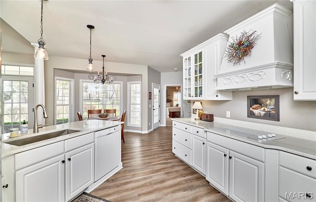 269 Bennington Dr, Troy, MO 63379 - kitchen with white dishwasher, electric stovetop, custom exhaust hood, light wood-type flooring, and light countertops