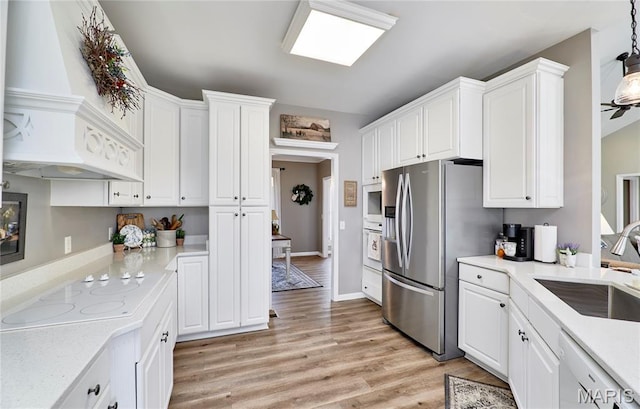 269 Bennington Dr, Troy, MO 63379 - kitchen with white appliances, white cabinetry, light wood-type flooring, and premium range hood