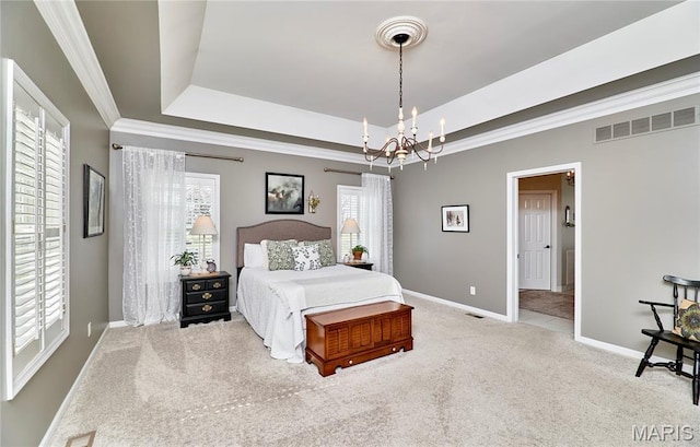 269 Bennington Dr, Troy, MO 63379 - carpeted bedroom with a tray ceiling, a chandelier, and ornamental molding