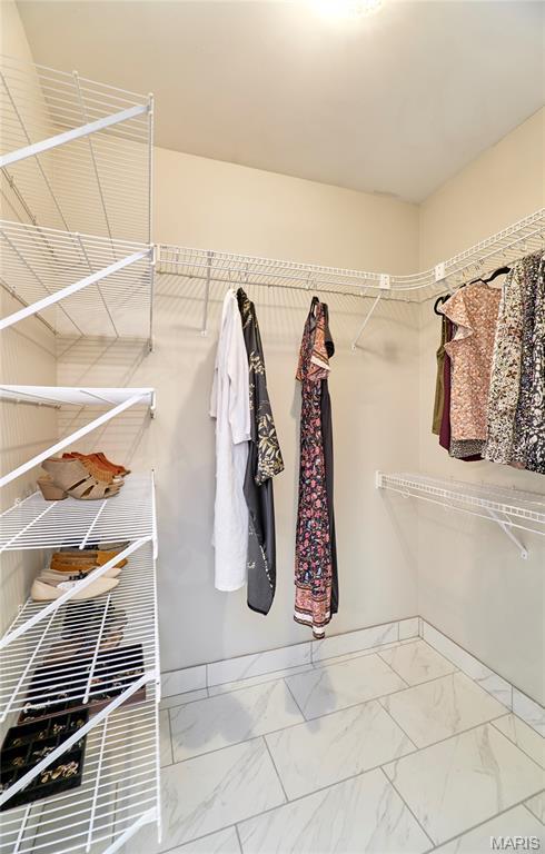 269 Bennington Dr, Troy, MO 63379 - walk in closet featuring marble look tile flooring