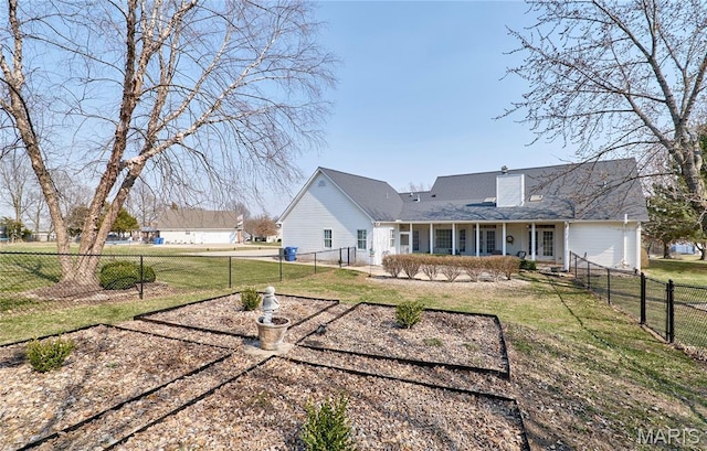 269 Bennington Dr, Troy, MO 63379 - rear view of property featuring a fenced backyard, a chimney, and a porch