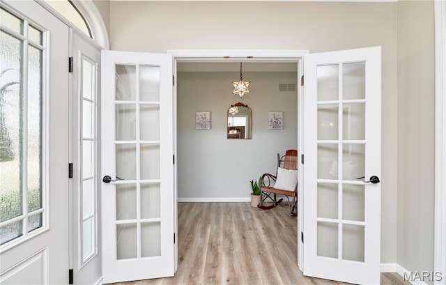 269 Bennington Dr, Troy, MO 63379 - doorway with french doors and light wood-style floors