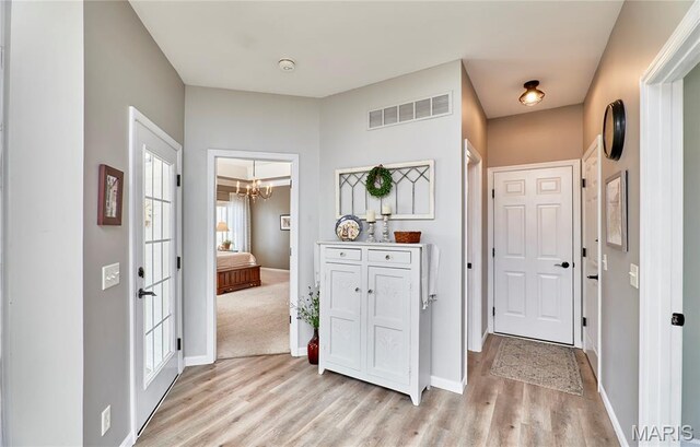 269 Bennington Dr, Troy, MO 63379 - entrance foyer featuring light wood-style floors and a chandelier