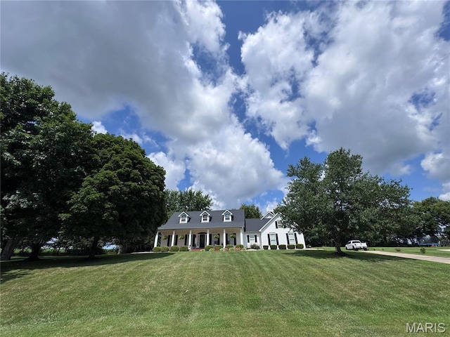 269 Bennington Dr, Troy, MO 63379 - cape cod house featuring a front yard and a porch