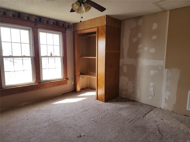701 Alsey Smith Rd, Alsey, IL 62610 - carpeted spare room with ceiling fan and a textured ceiling
