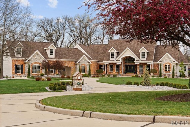 261 US Dr, Wentzville, MO 63385 - cape cod house featuring stone siding and a front yard