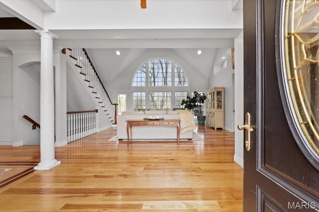 261 US Dr, Wentzville, MO 63385 - foyer featuring light wood-style floors, stairway, lofted ceiling, recessed lighting, and baseboards
