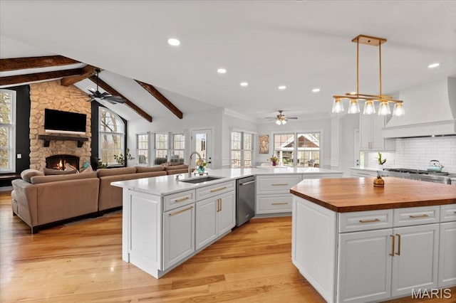 261 US Dr, Wentzville, MO 63385 - kitchen featuring ceiling fan, a sink, wooden counters, premium range hood, and recessed lighting