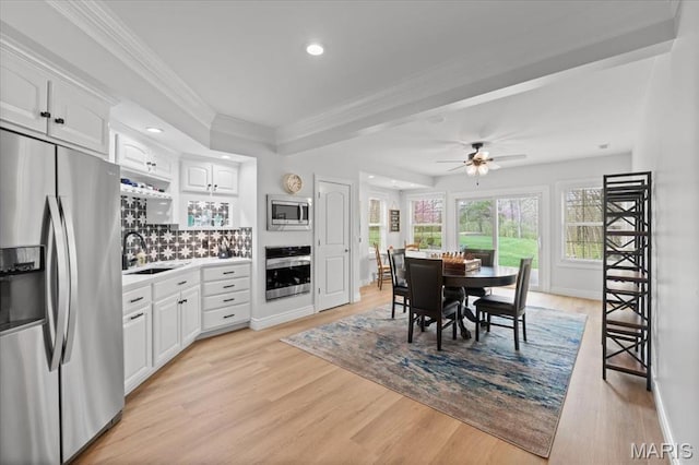 261 US Dr, Wentzville, MO 63385 - dining room with crown molding, light wood-type flooring, a ceiling fan, baseboards, and recessed lighting