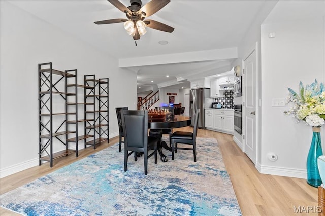 261 US Dr, Wentzville, MO 63385 - dining room with stairs, a ceiling fan, light wood-type flooring, and baseboards