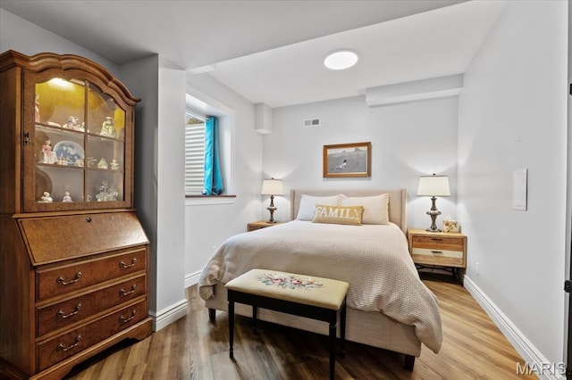 261 US Dr, Wentzville, MO 63385 - bedroom featuring light wood-style flooring and baseboards
