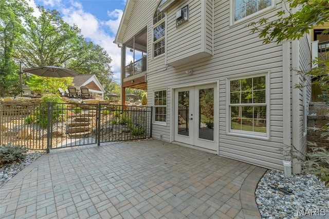 261 US Dr, Wentzville, MO 63385 - view of patio / terrace featuring a balcony, fence, and french doors