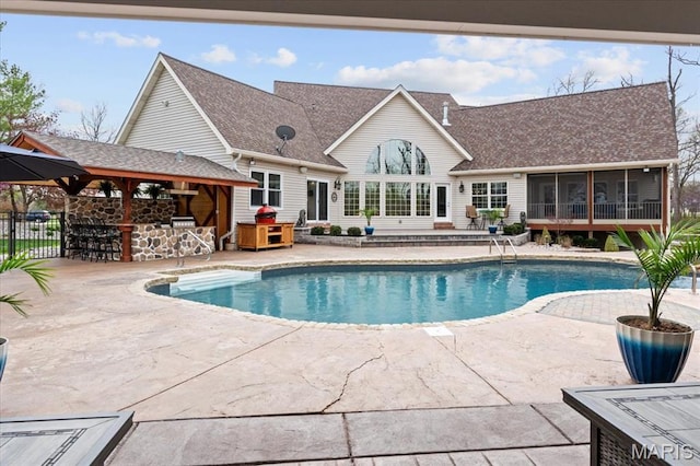 261 US Dr, Wentzville, MO 63385 - view of swimming pool featuring a sunroom, a patio area, and fence