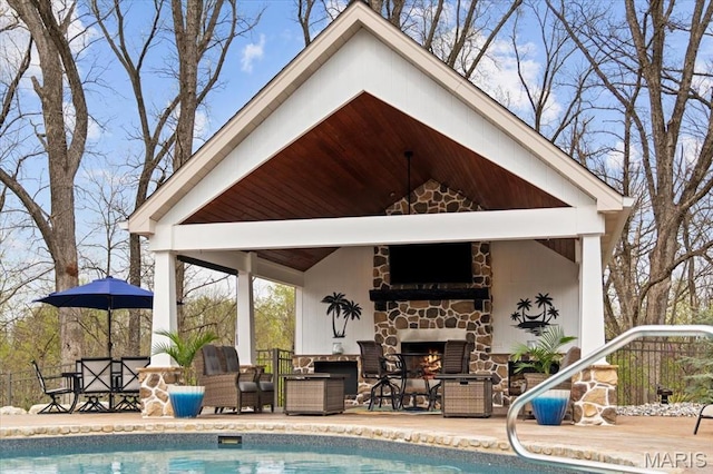 261 US Dr, Wentzville, MO 63385 - swimming pool featuring a gazebo, an outdoor living space with a fireplace, and fence