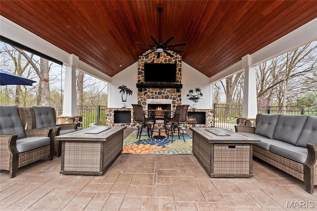 261 US Dr, Wentzville, MO 63385 - view of patio featuring an outdoor living space with a fireplace, ceiling fan, and fence
