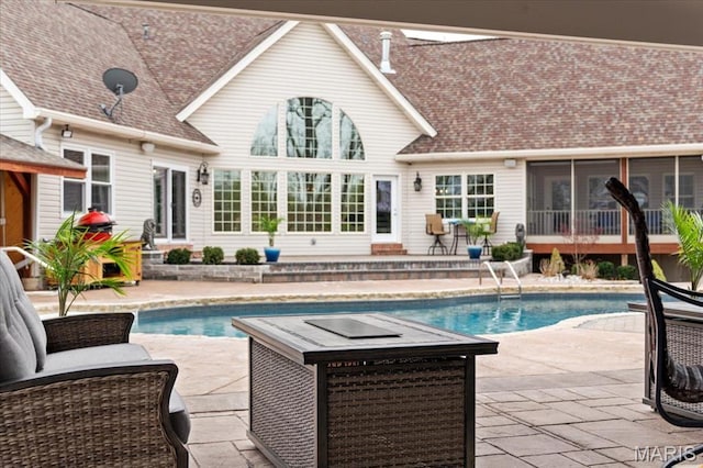 261 US Dr, Wentzville, MO 63385 - swimming pool with a patio and a sunroom