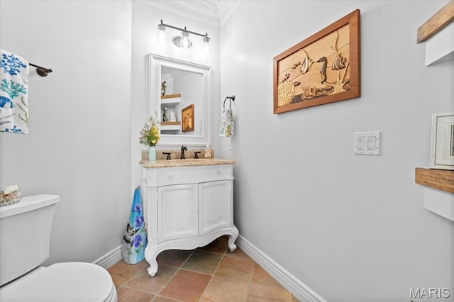 261 US Dr, Wentzville, MO 63385 - bathroom featuring baseboards, toilet, crown molding, stone finish flooring, and vanity