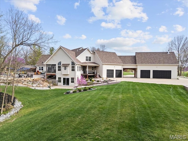 261 US Dr, Wentzville, MO 63385 - view of front facade featuring concrete driveway, a garage, a front lawn, and a shingled roof