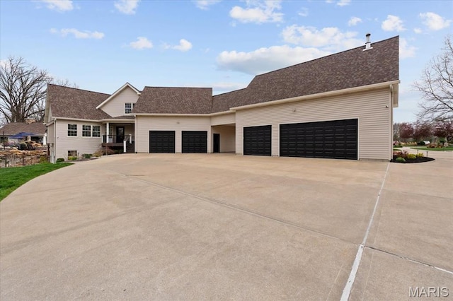 261 US Dr, Wentzville, MO 63385 - view of front of property with an attached garage, driveway, and a shingled roof