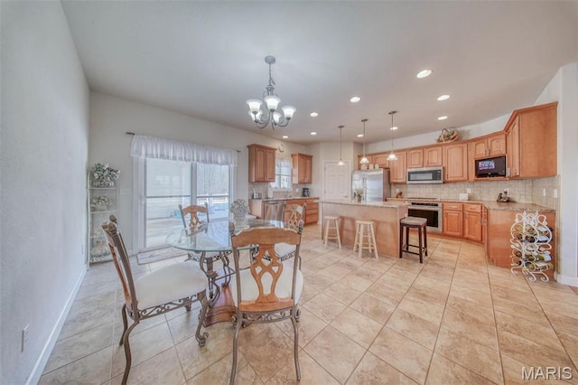 17205 Elk Prairie Dr, Rolla, MO 65401 - dining space featuring a chandelier, recessed lighting, baseboards, and light tile patterned flooring
