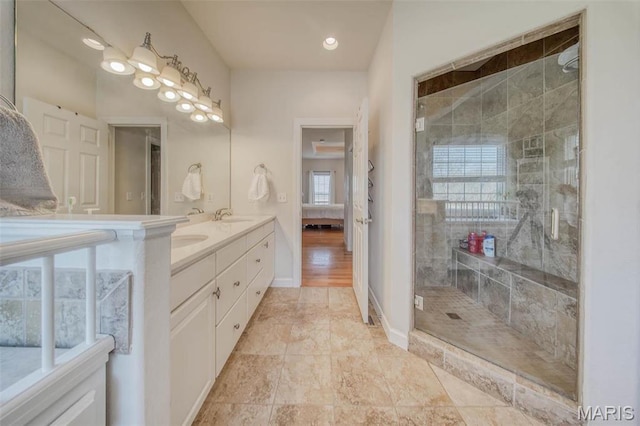 17205 Elk Prairie Dr, Rolla, MO 65401 - bathroom with a shower stall, double vanity, and baseboards