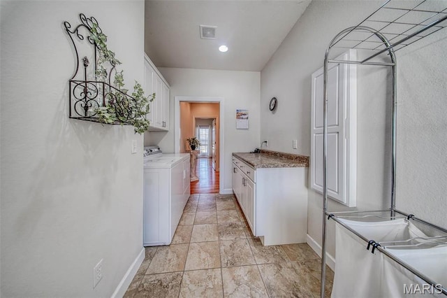 17205 Elk Prairie Dr, Rolla, MO 65401 - laundry area featuring cabinet space, separate washer and dryer, and baseboards