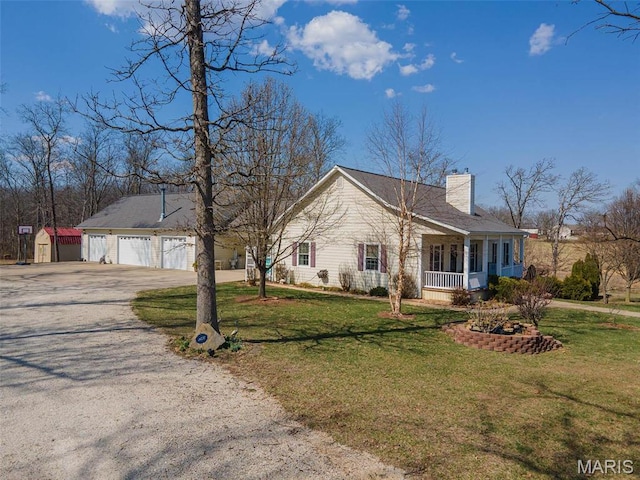 17205 Elk Prairie Dr, Rolla, MO 65401 - ranch-style house with covered porch, a chimney, driveway, and a front lawn