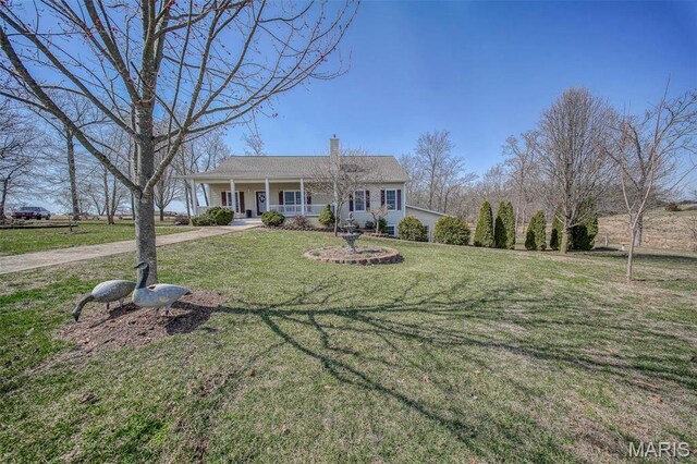 17205 Elk Prairie Dr, Rolla, MO 65401 - ranch-style house featuring covered porch, a front lawn, and a chimney