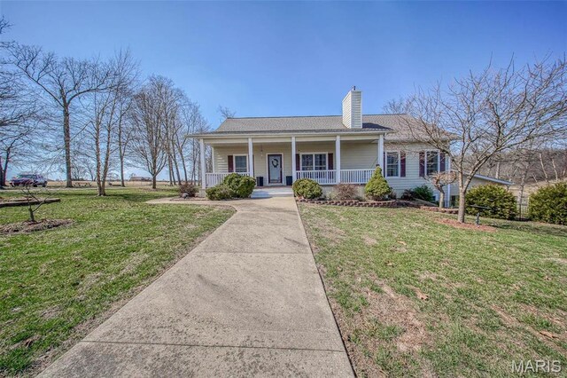 17205 Elk Prairie Dr, Rolla, MO 65401 - view of front facade featuring covered porch, a chimney, and a front yard