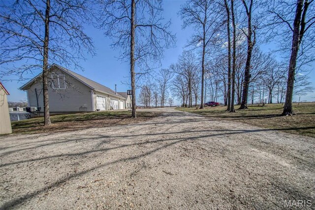 17205 Elk Prairie Dr, Rolla, MO 65401 - view of yard featuring driveway and a garage