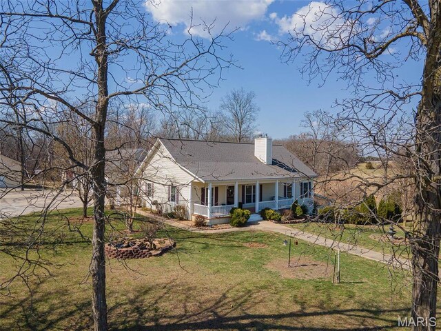 17205 Elk Prairie Dr, Rolla, MO 65401 - view of front of property with a porch, a chimney, and a front yard
