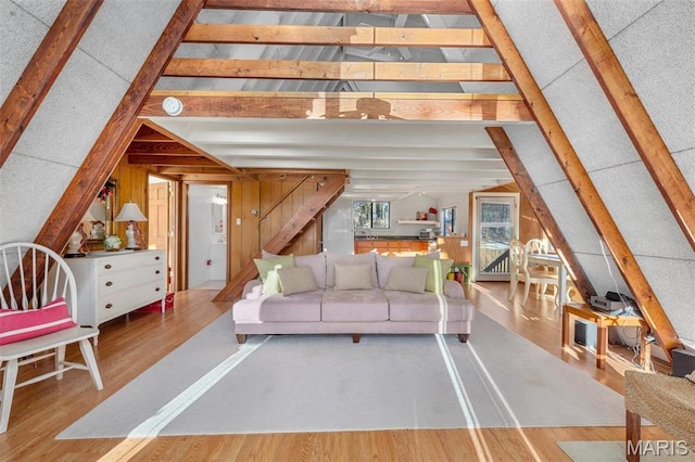 372 Alpine Lake Dr, Wright City, MO 63390 - living room with wood finished floors, stairway, and wooden walls