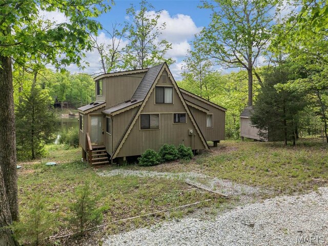 372 Alpine Lake Dr, Wright City, MO 63390 - view of side of home featuring roof with shingles