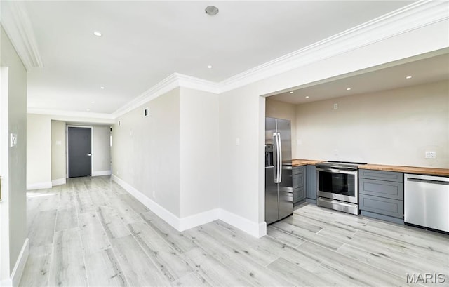 601 Brotherton Ln, Saint Louis, MO 63135 - kitchen with butcher block countertops, appliances with stainless steel finishes, gray cabinets, light wood-style floors, and ornamental molding
