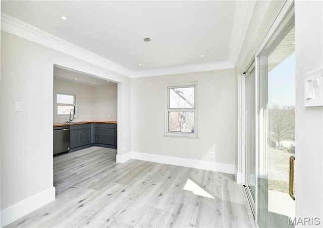 601 Brotherton Ln, Saint Louis, MO 63135 - spare room with a sink, light wood finished floors, baseboards, ornamental molding, and recessed lighting