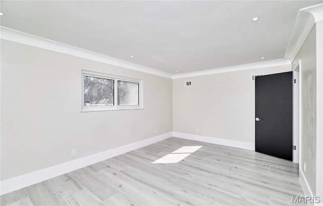 601 Brotherton Ln, Saint Louis, MO 63135 - spare room featuring crown molding, light wood finished floors, baseboards, and recessed lighting