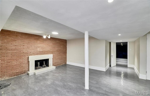 601 Brotherton Ln, Saint Louis, MO 63135 - finished below grade area with a brick fireplace, baseboards, and brick wall