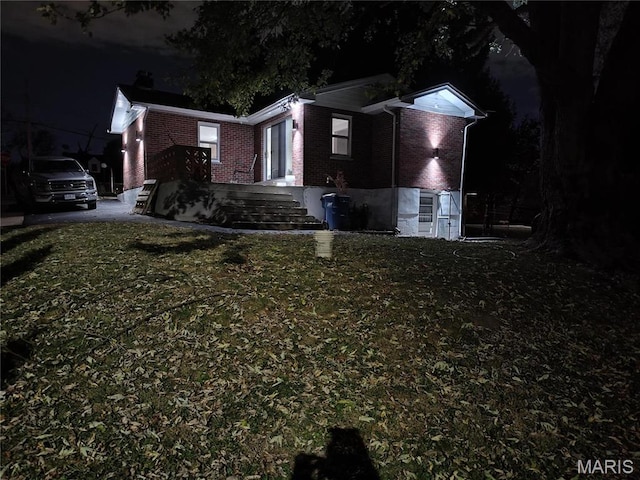 601 Brotherton Ln, Saint Louis, MO 63135 - view of front of home featuring brick siding and a front lawn