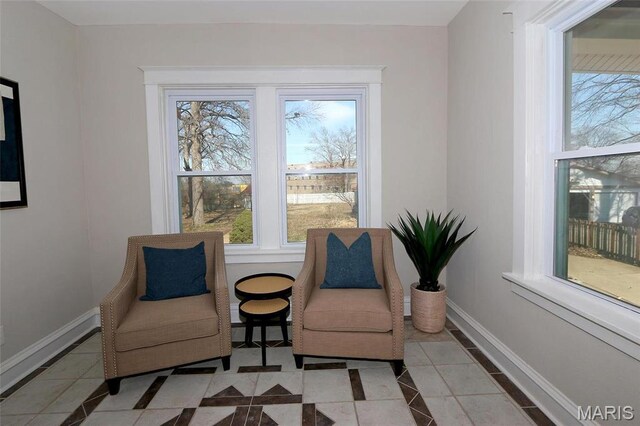 3092 Bellerive Dr, Saint Louis, MO 63121 - sitting room featuring inlaid floor details, healthy amount of natural light, baseboards, and tile patterned floors