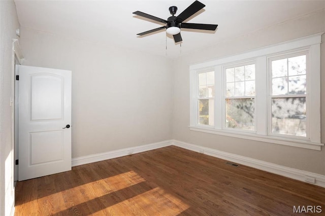 3092 Bellerive Dr, Saint Louis, MO 63121 - empty room with baseboards, wood finished floors, and a ceiling fan