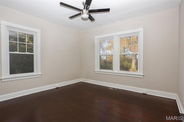 3092 Bellerive Dr, Saint Louis, MO 63121 - empty room with baseboards, dark wood-type flooring, and a ceiling fan
