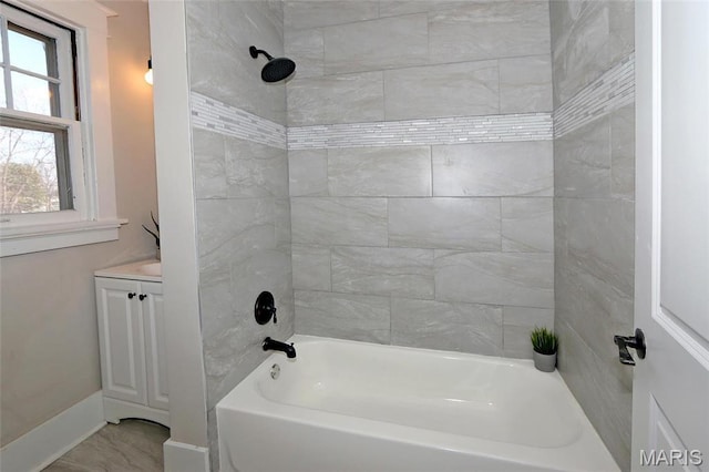 3092 Bellerive Dr, Saint Louis, MO 63121 - bathroom featuring tub / shower combination, baseboards, and vanity