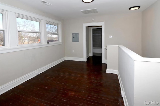 3092 Bellerive Dr, Saint Louis, MO 63121 - corridor featuring hardwood / wood-style floors, an upstairs landing, baseboards, and electric panel